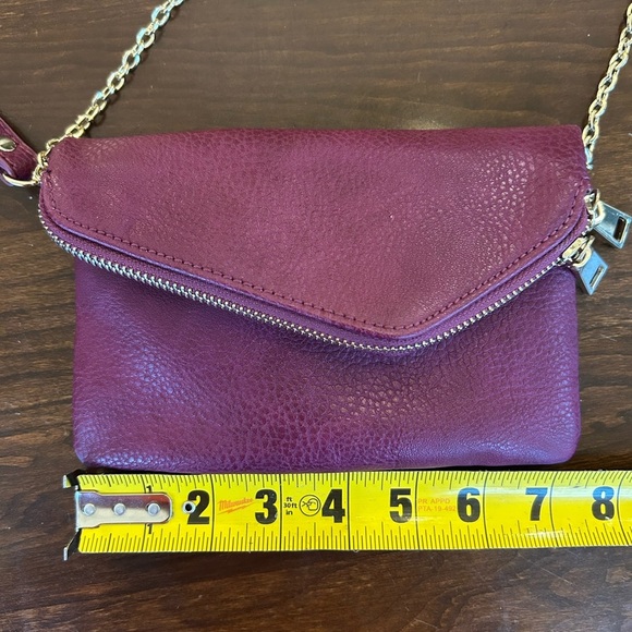 Burgundy Urban Expression Crossbody Vegan leather clutch purse gold detail. - Picture 9 of 10